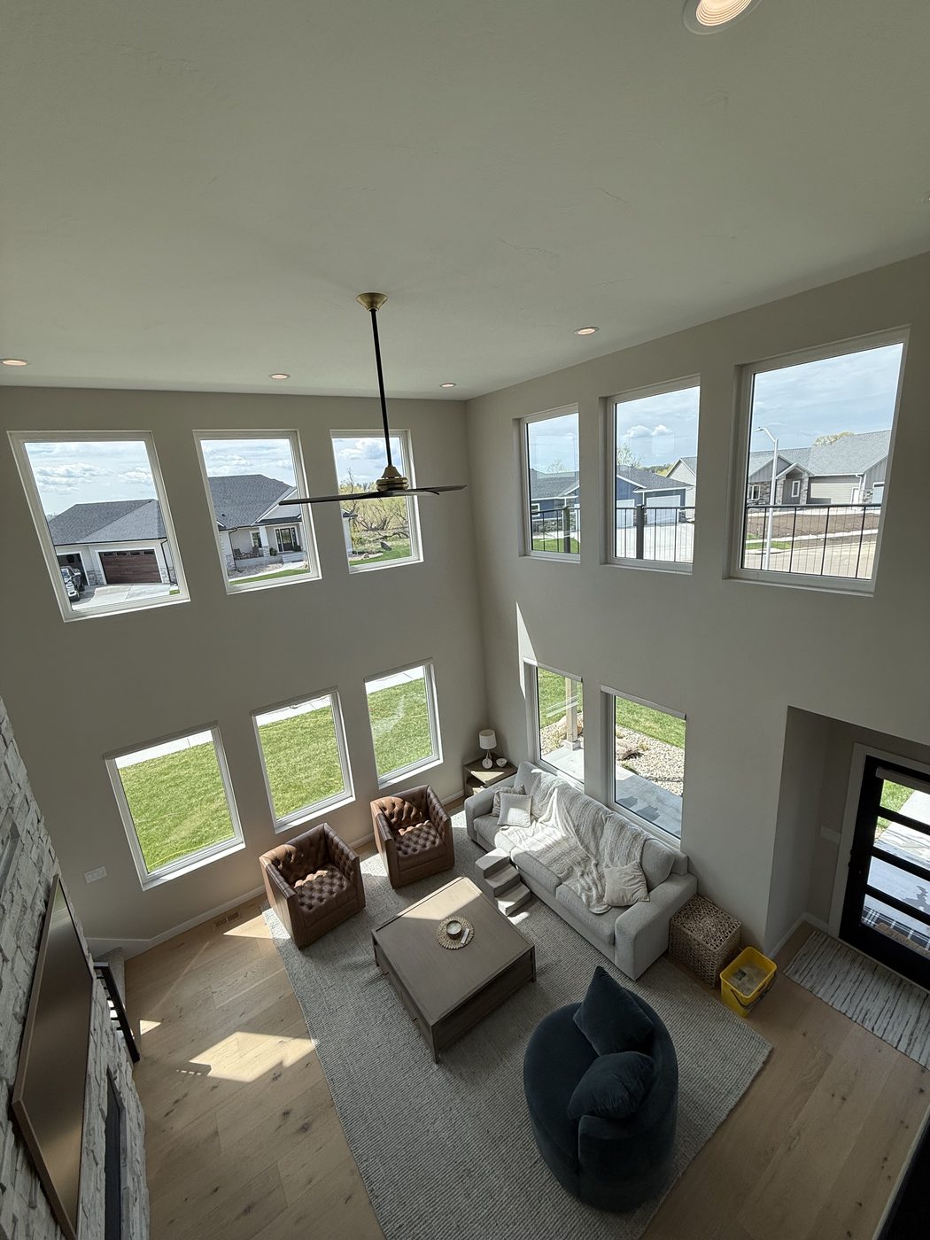 Sunlit great room with a wall of spotless windows