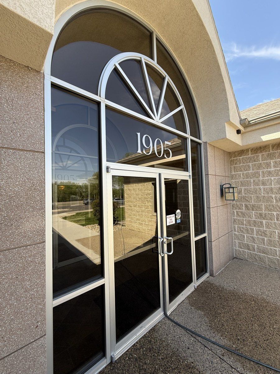 Freshly cleaned glass storefront in Sioux Falls